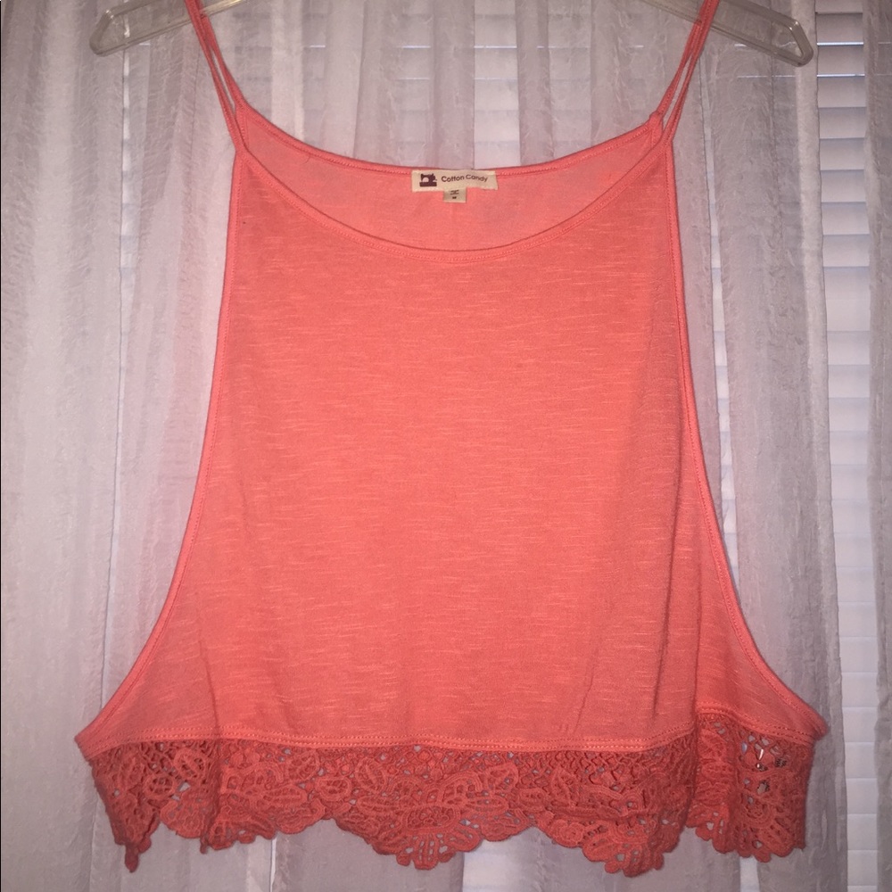 Pink tank top with lace like detailing in bottom